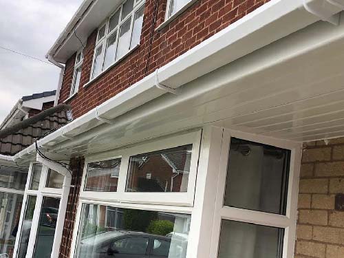 Close-up of uPVC guttering fixed to a fascia board