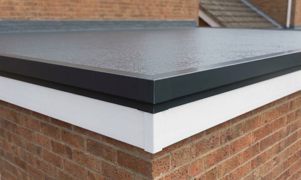 Close-up of a GRP fibreglass flat roof with drip trim fitted by Potteries Fascias in Stoke-on-Trent