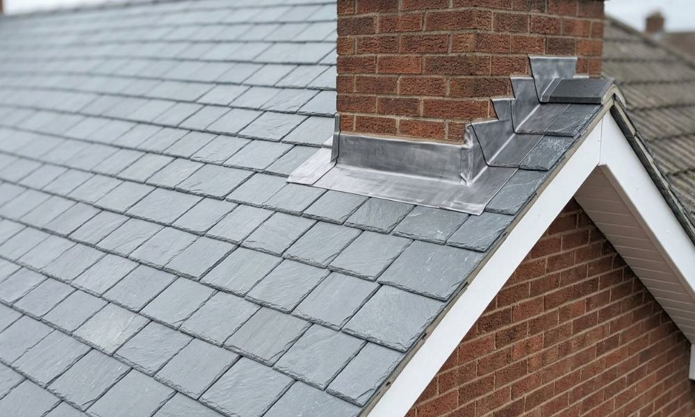 Close-up of new natural slate roof with lead flashing fitted by Potteries Fascias in Stoke-on-Trent