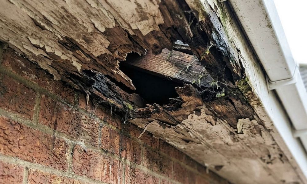 Rotten and damaged timber soffit on a Stoke-on-Trent property in need of replacement